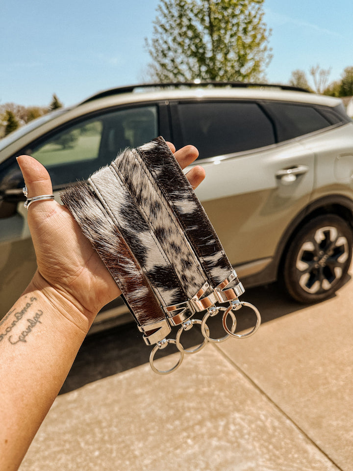 Mooving On Cowhide Wristlet